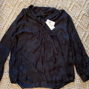 Banana Republic….100% polyester blouse, ties at neck